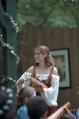Some girl playing a musical instrument.