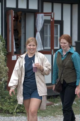 Loralie and Tamara return from hunting drinks.