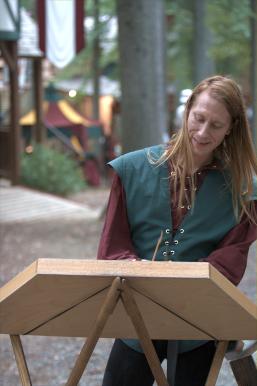 Guy playing a hammer dulcimer.
