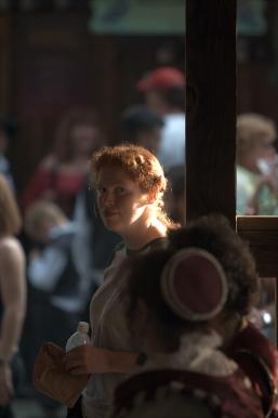 Tamara at a pub listening to bag pipe music.